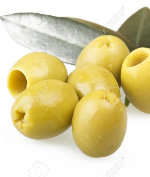 Pitted green olives close up on the white